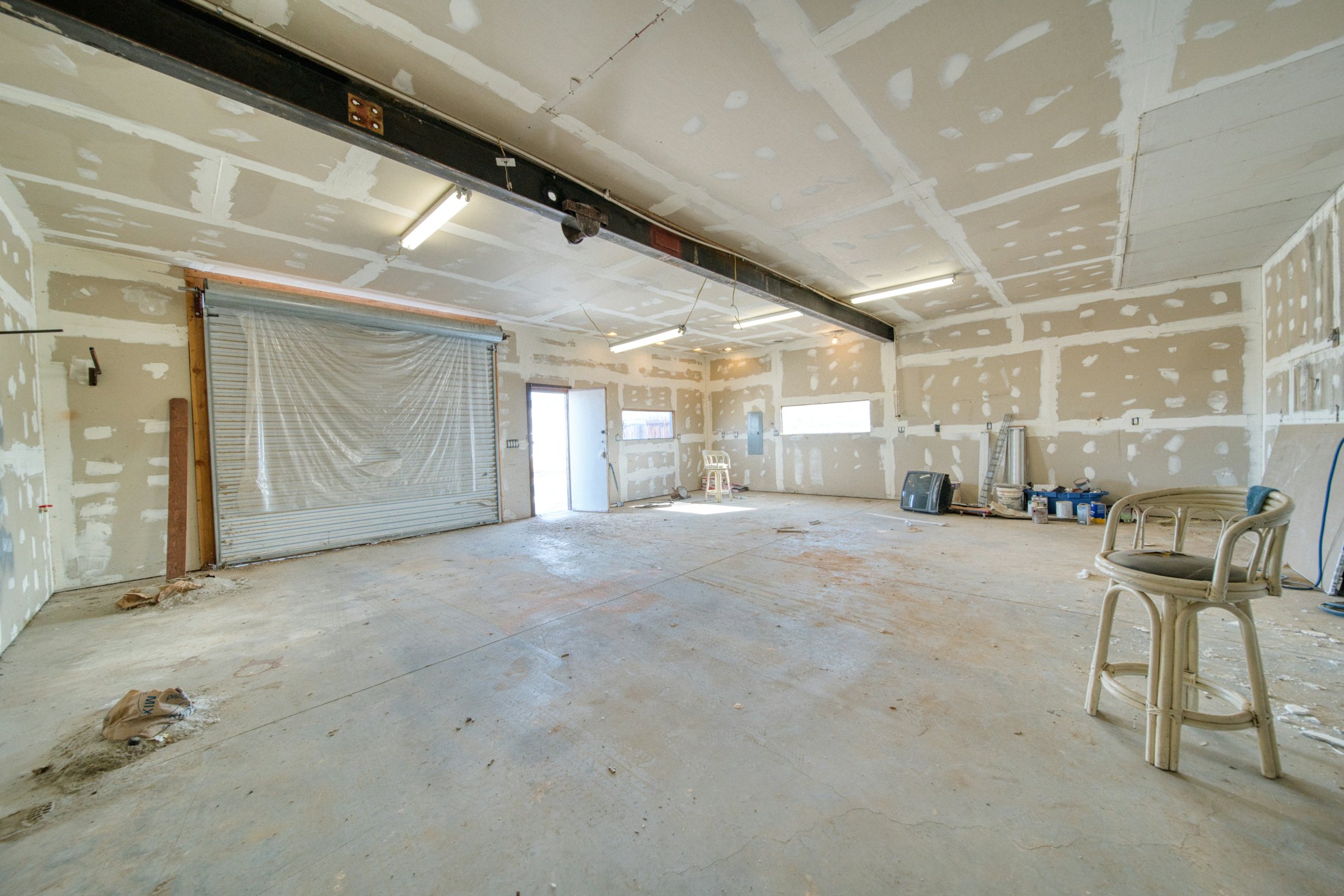 Large interior with fresh drywall and taped seams
